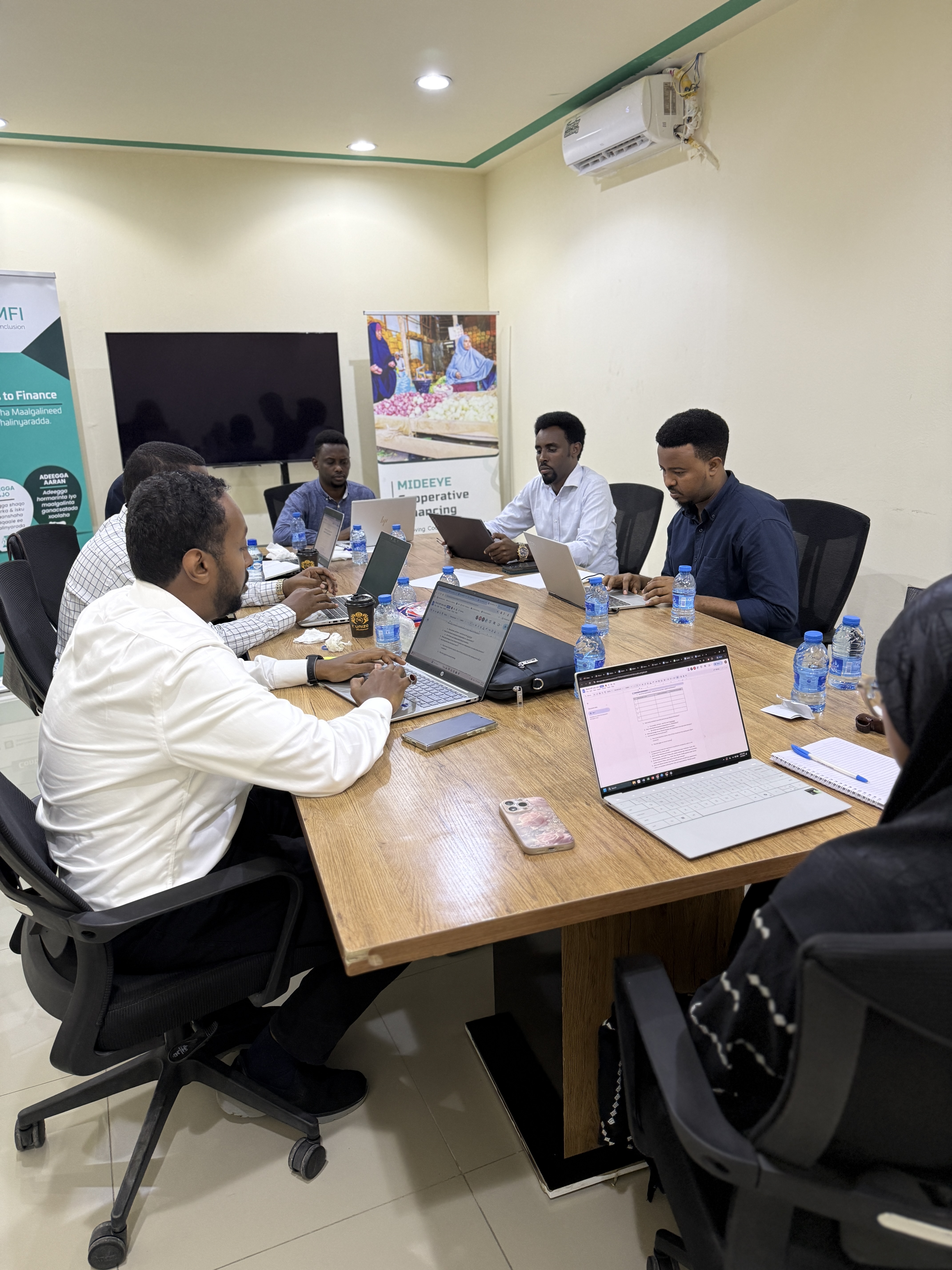 RAAS MFI community savings group meeting